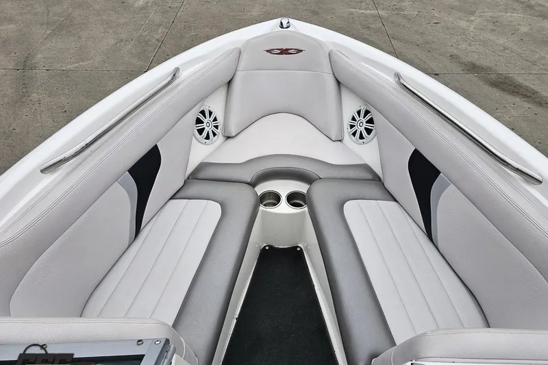 Slide: The Image of 2005 MasterCraft X-2 boat interior with gray seating and cup holders. - 64