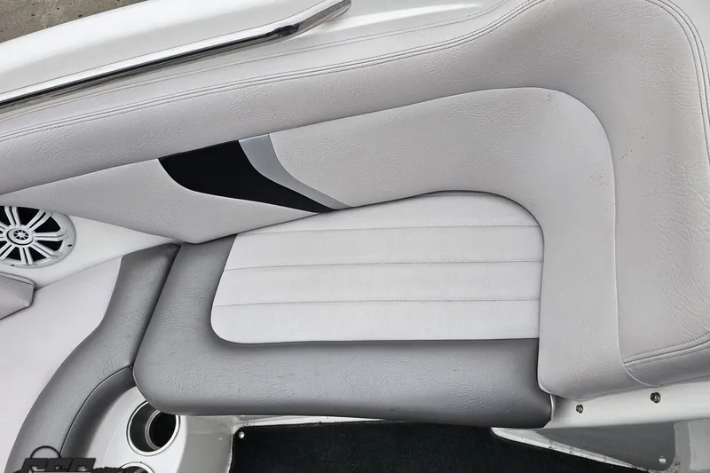 Slide: The Image of 2005 MasterCraft X-2 boat interior with gray and white upholstery and speaker detail. - 65