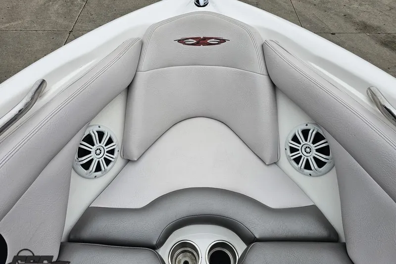 Slide: The Image of Interior of a 2005 MasterCraft X-2 boat with speakers and cushioned seating. - 69