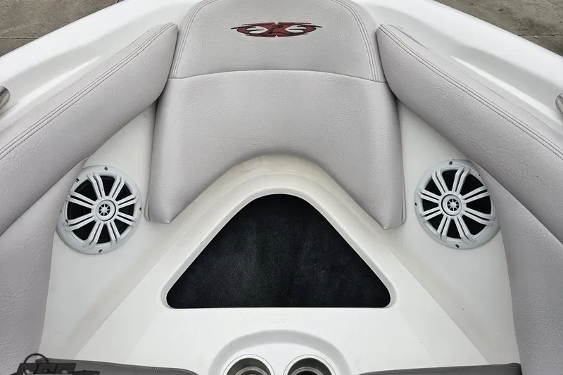 Slide: The Image of Interior of a 2005 MasterCraft X-2 boat with speakers and cushioned seating. - 70