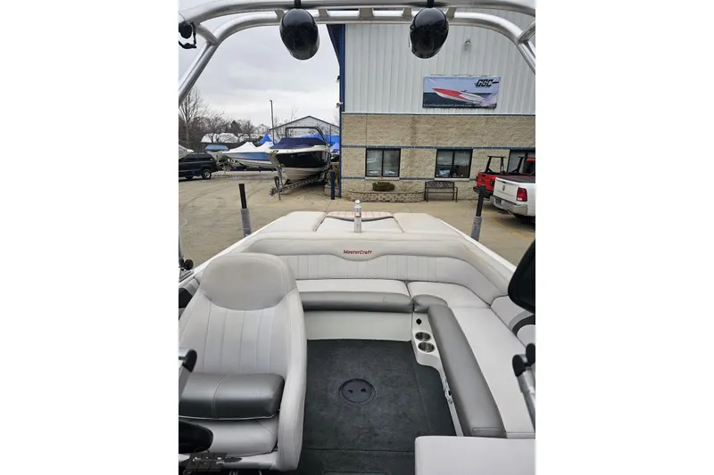 Slide: The Image of Interior of a 2005 MasterCraft X-2 boat with gray seating and cup holders. - 71