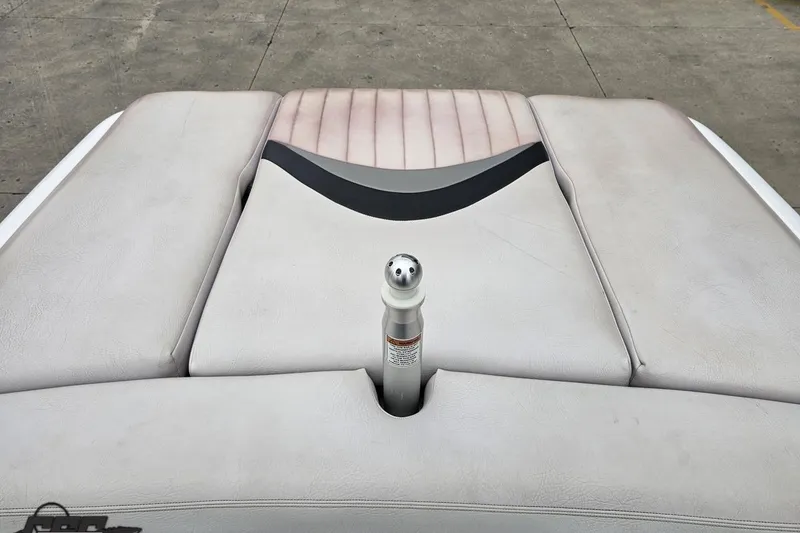 Slide: The Image of 2005 MasterCraft X-2 boat interior with cushioned seating and ski pylon. - 75