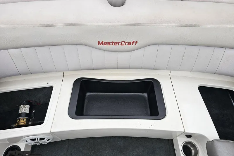 Slide: The Image of 2005 MasterCraft X-2 boat interior with storage compartments and seating. - 78