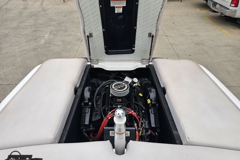 Slide: The Image of 2005 MasterCraft X-2 boat engine compartment with open hatch, showcasing engine details. - 80