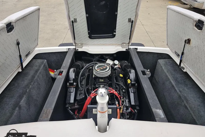 Slide: The Image of 2005 MasterCraft X-2 boat engine compartment with open hatches, showcasing engine details. - 81
