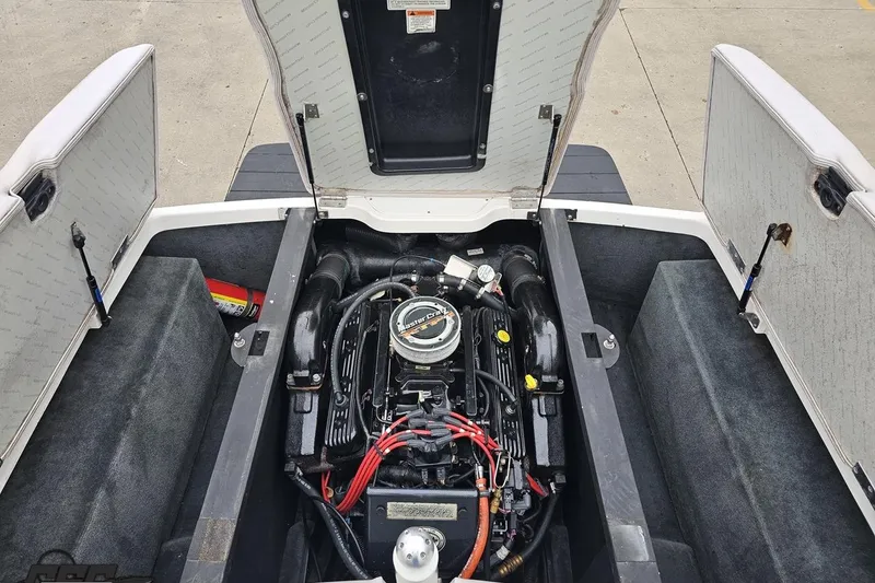 Slide: The Image of 2005 MasterCraft X-2 engine compartment with open hatches, showcasing the engine and interior layout. - 82