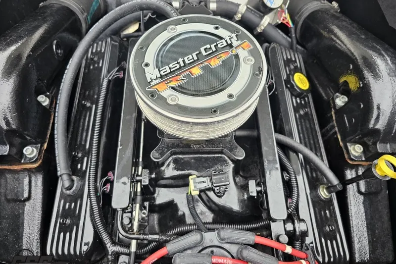 Slide: The Image of 2005 MasterCraft X-2 engine close-up, showcasing detailed components and branding. - 84
