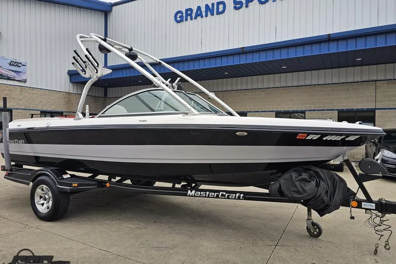 Slide: The Image of 2005 MasterCraft X-2 boat on trailer outside Grand Sport Center. - 9