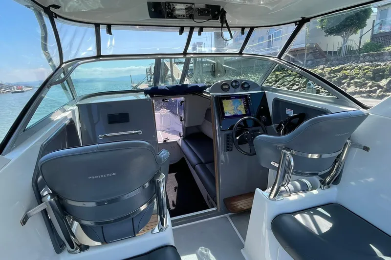 Slide: The Image of Interior of a 2006 Protector Targa 28 boat with modern navigation equipment. - 10