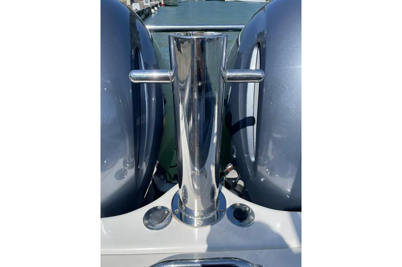 Slide: The Image of 2006 Protector Targa 28 boat cleat with dual engines in background. - 18