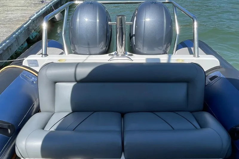 Slide: The Image of 2006 Protector Targa 28 boat with dual engines and cushioned seating. - 23