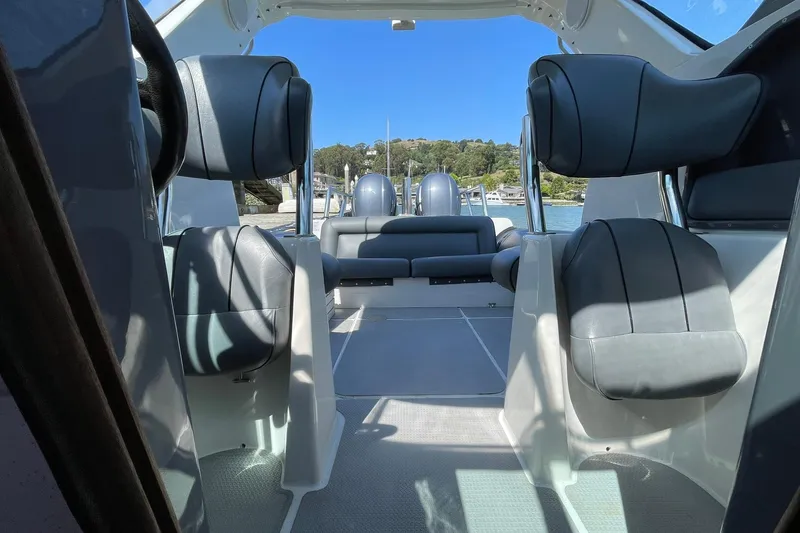 Slide: The Image of Interior view of a 2006 Protector Targa 28 boat with sleek seating and open cabin. - 27