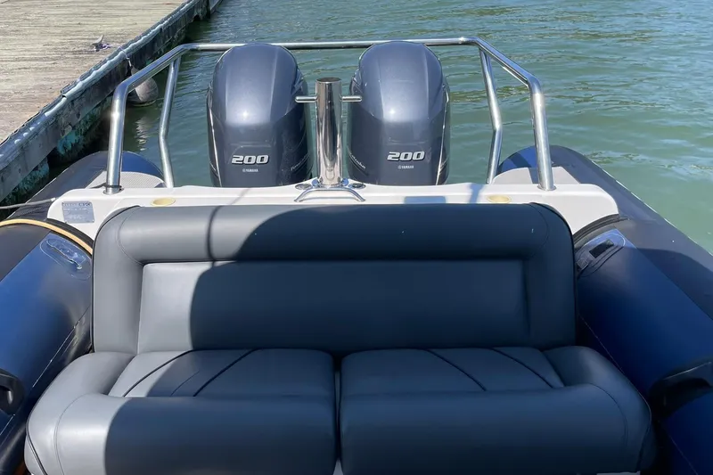 Slide: The Image of 2006 Protector Targa 28 boat with dual Yamaha 200 engines at dock. - 30
