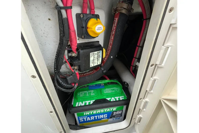 Slide: The Image of Battery compartment of a 2006 Protector Targa 28 with Interstate marine battery. - 33