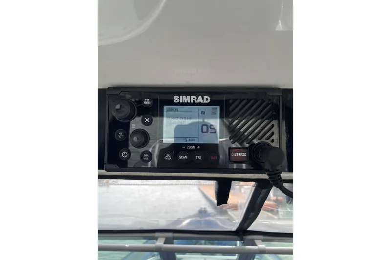 Slide: The Image of Simrad marine radio on 2006 Protector Targa 28 boat dashboard, displaying navigation details. - 35
