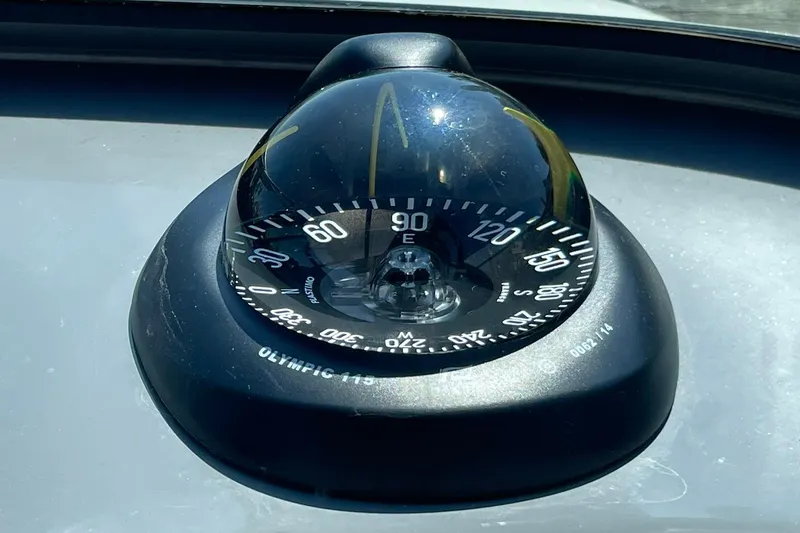 Slide: The Image of Compass on 2006 Protector Targa 28 boat dashboard, showing east direction. - 37