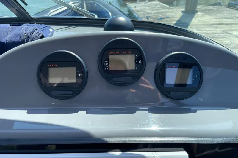 Slide: The Image of Dashboard of a 2006 Protector Targa 28 boat with Yamaha gauges. - 38