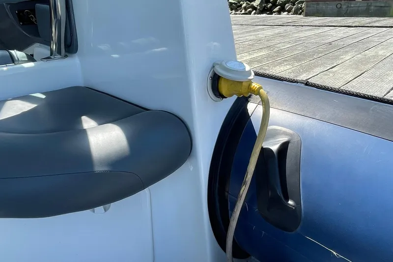 Slide: The Image of 2006 Protector Targa 28 boat with shore power connection on deck. - 42