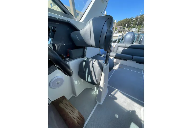 Slide: The Image of 2006 Protector Targa 28 boat interior with seating and steering wheel. - 44