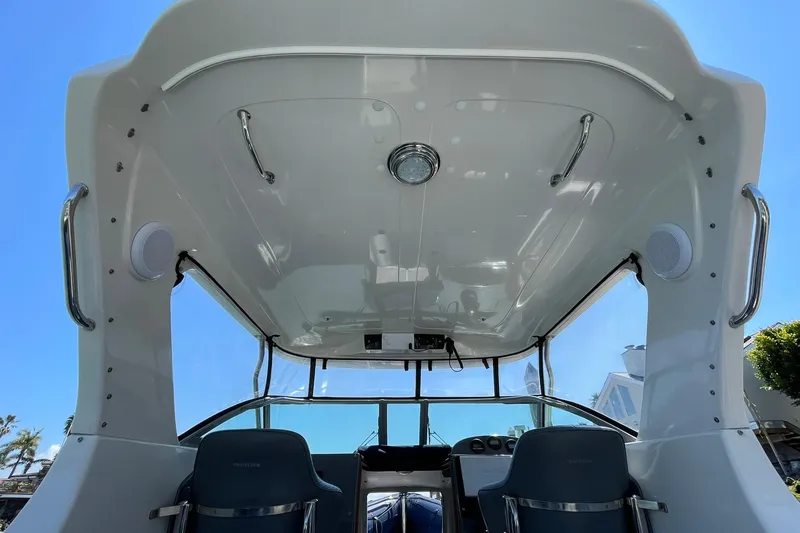 Slide: The Image of Interior view of a 2006 Protector Targa 28 boat, showcasing helm and seating area. - 47