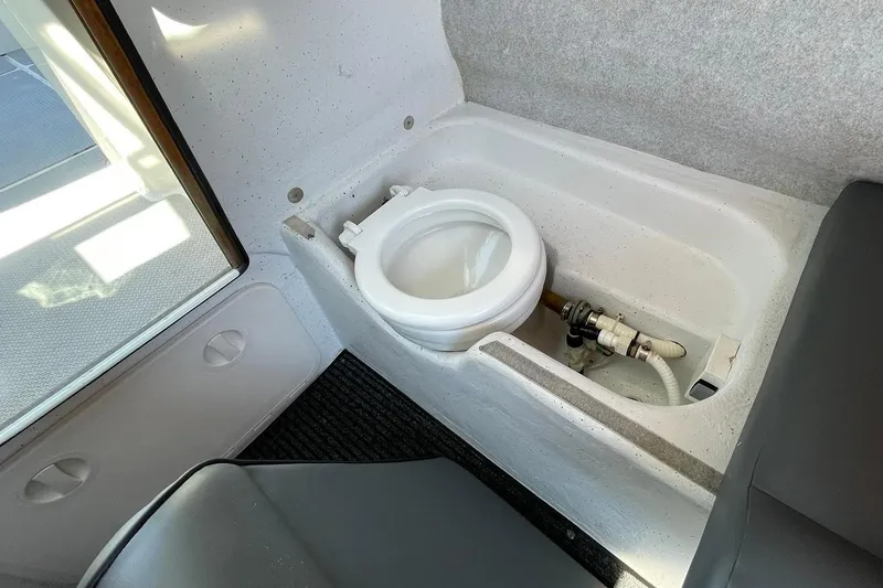 Slide: The Image of 2006 Protector Targa 28 boat interior with compact marine toilet. - 49