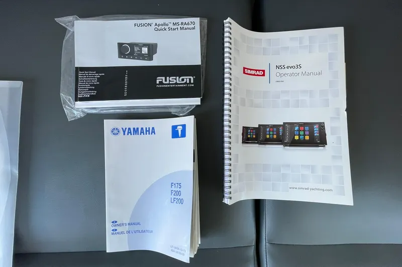 Slide: The Image of Manuals for Fusion Apollo, Simrad NSS evo3S, and Yamaha engines on a 2006 Protector Targa 28. - 58