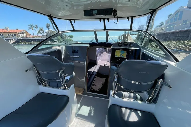 Slide: The Image of Interior of a 2006 Protector Targa 28 boat with helm console. - 8