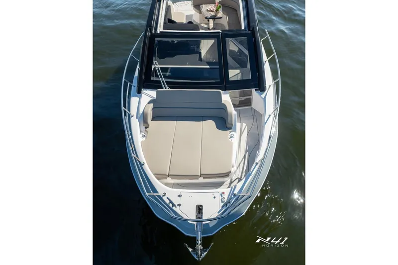 Slide: The Image of 2025 NX Boats NX41 HORIZON luxury yacht on water, featuring sleek design and spacious deck. - 13