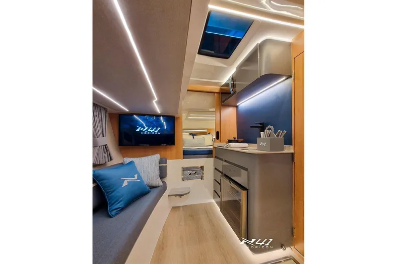 Slide: The Image of Luxurious interior of 2025 NX Boats NX41 HORIZON, featuring modern design and ambient lighting. - 17