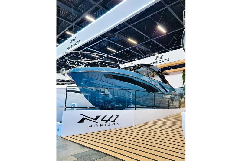 Slide: The Image of 2025 NX Boats NX41 HORIZON showcased at a boat exhibition, featuring sleek design and modern aesthetics. - 3
