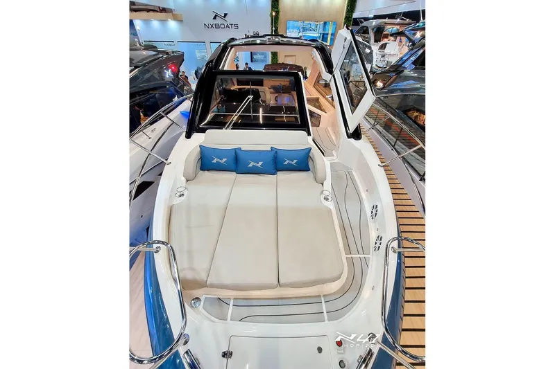 Slide: The Image of 2025 NX Boats NX41 HORIZON luxury yacht interior with plush seating and modern design. - 9