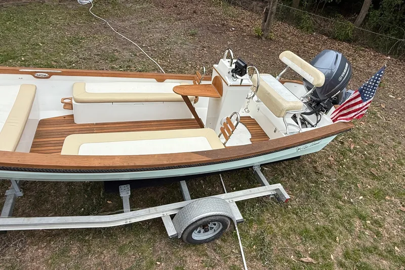 Slide: The Image of 2014 Sea Skiff Caribiana boat on trailer with American flag and Yamaha motor. - 3