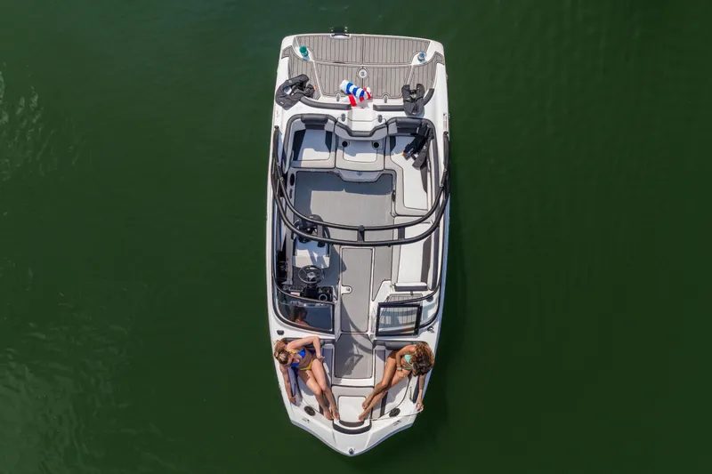 Slide: The Image of Manufacturer Provided Image: 2026 Yamaha Boats AR195 on water, top view with two people relaxing onboard. - 11