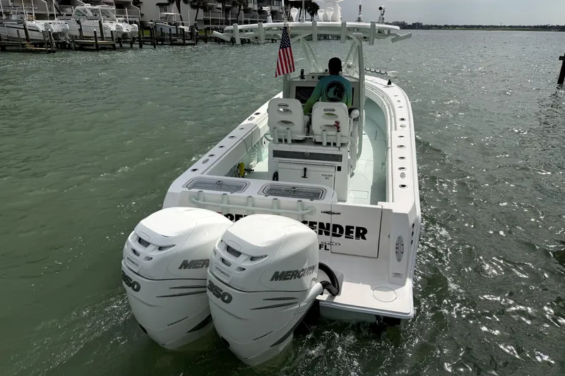 Slide: The Image of 2019 Contender 30 ST boat with dual Mercury engines on the water. - 10