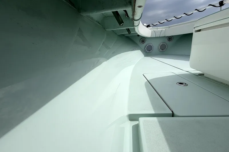 Slide: The Image of 2019 Contender 30 ST boat interior, showcasing sleek design and storage compartments. - 12
