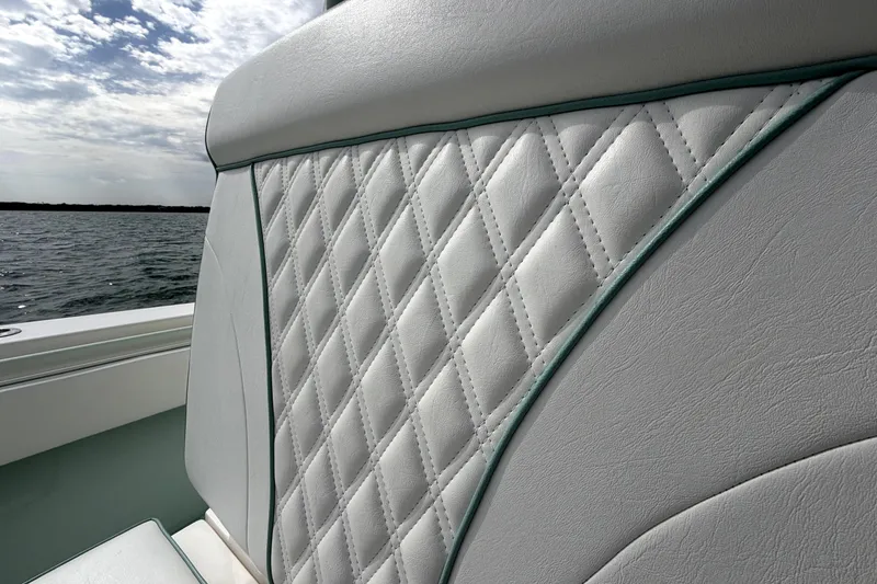 Slide: The Image of Quilted seat detail on 2019 Contender 30 ST boat with ocean backdrop. - 16