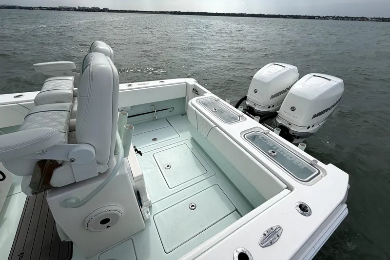 Slide: The Image of 2019 Contender 30 ST boat with dual Mercury outboard engines on open water. - 29