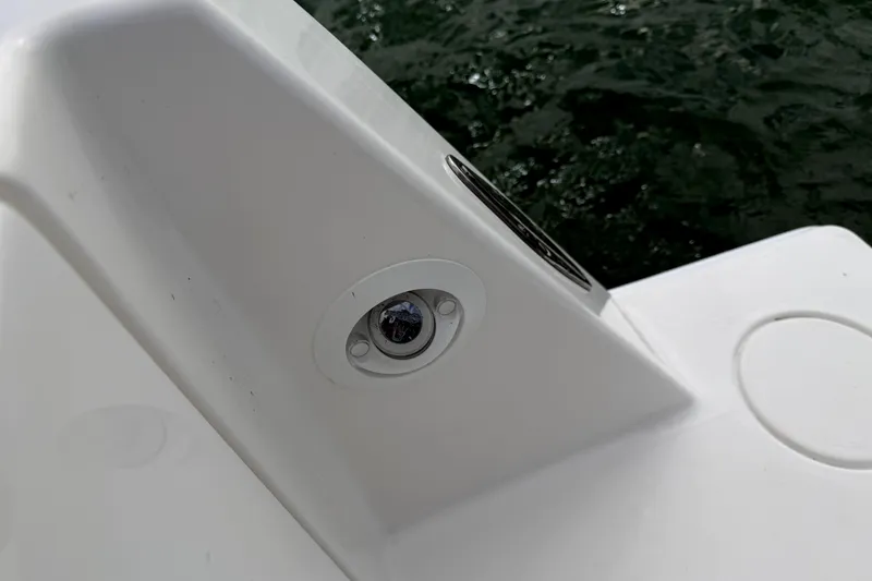 Slide: The Image of Close-up of a 2019 Contender 30 ST boat detail near water. - 36