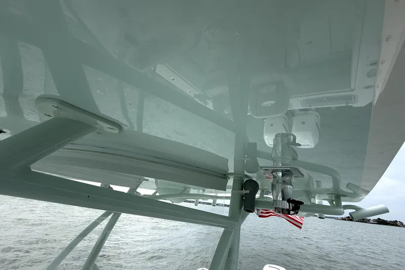 Slide: The Image of 2019 Contender 30 ST boat with T-top and American flag, viewed from below. - 39