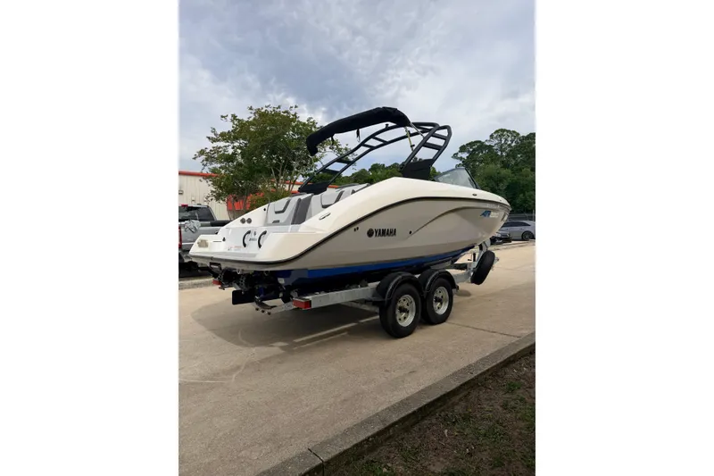 The Image of 2026 Yamaha Boats AR220 on trailer, parked outdoors, showcasing sleek design and modern features. - 0