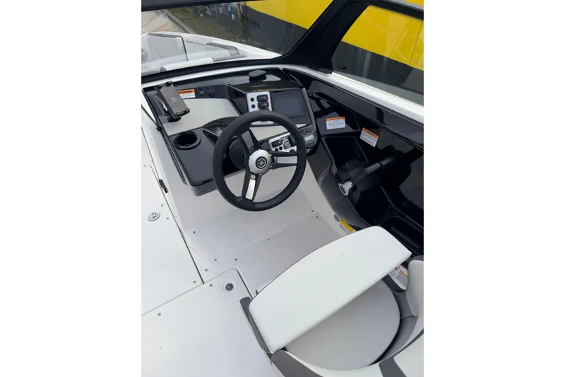 Slide: The Image of 2026 Yamaha Boats AR220 cockpit with steering wheel and control panel. - 10
