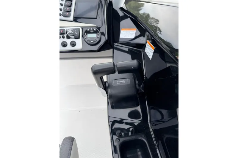 Slide: The Image of Control panel of 2026 Yamaha Boats AR220, featuring sleek design and advanced controls. - 13