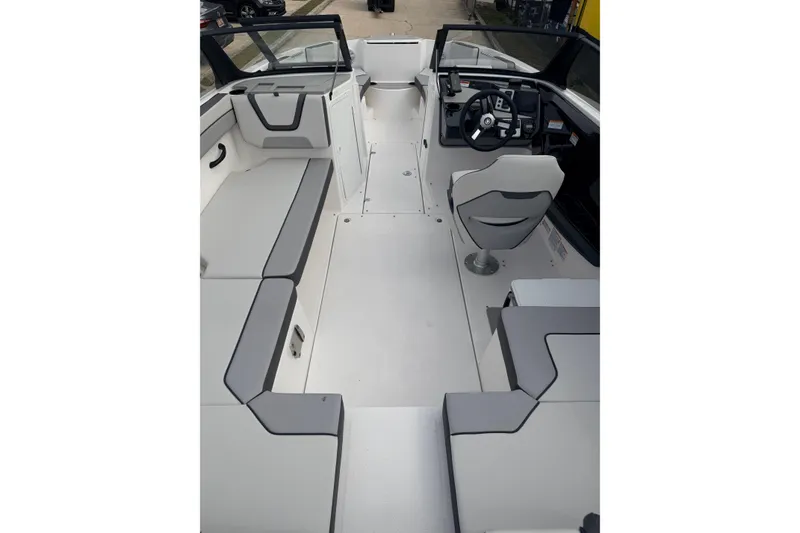 Slide: The Image of 2026 Yamaha Boats AR220 interior with sleek seating and modern dashboard design. - 5