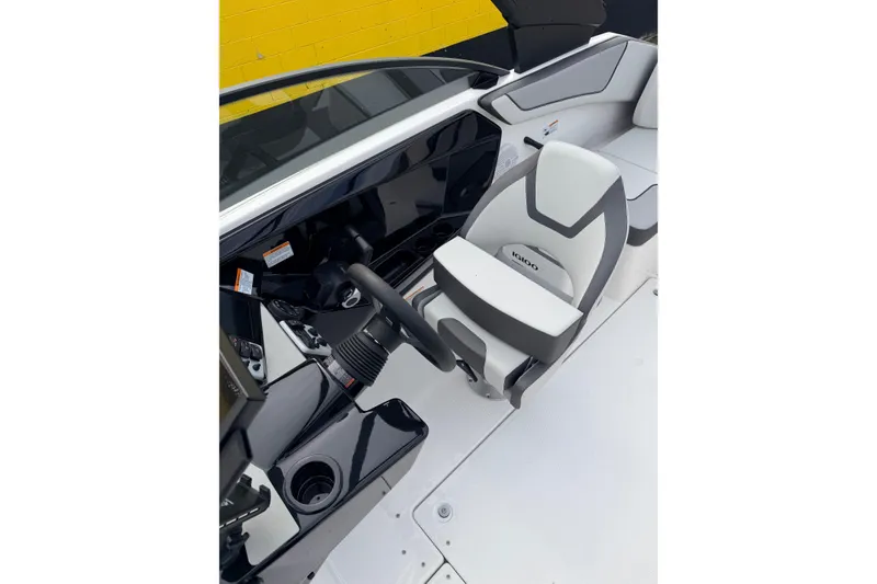 Slide: The Image of 2026 Yamaha Boats AR220 cockpit with sleek steering wheel and modern seating design. - 9