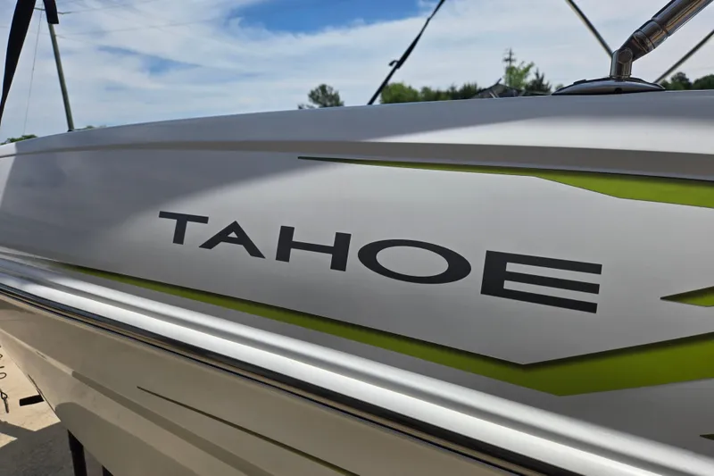 Slide: The Image of 2022 Tahoe T16 boat side view with logo and green accent. - 18