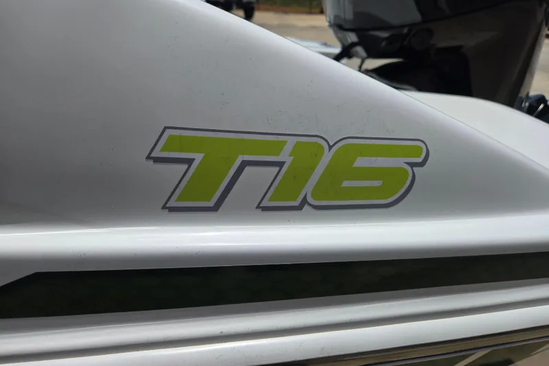 Slide: The Image of 2022 Tahoe T16 boat logo in bold green lettering on white surface. - 19