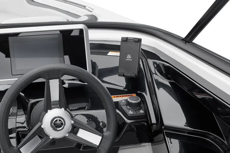 Slide: The Image of Manufacturer Provided Image: 2026 Yamaha AR250 boat dashboard with steering wheel and navigation controls. - 2