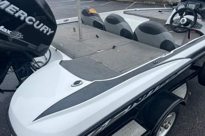 Slide: The Image of 2011 Nitro Z-6 boat with Mercury engine, featuring spacious seating and steering console. - 7