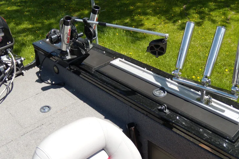 Slide: The Image of 2016 Tracker Targa V-18 WT boat interior with fishing rod holders and equipment. - 10
