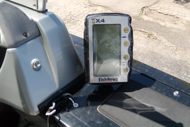 Slide: The Image of FishHawk X4 device on 2016 Tracker Targa V-18 WT boat dashboard. - 13
